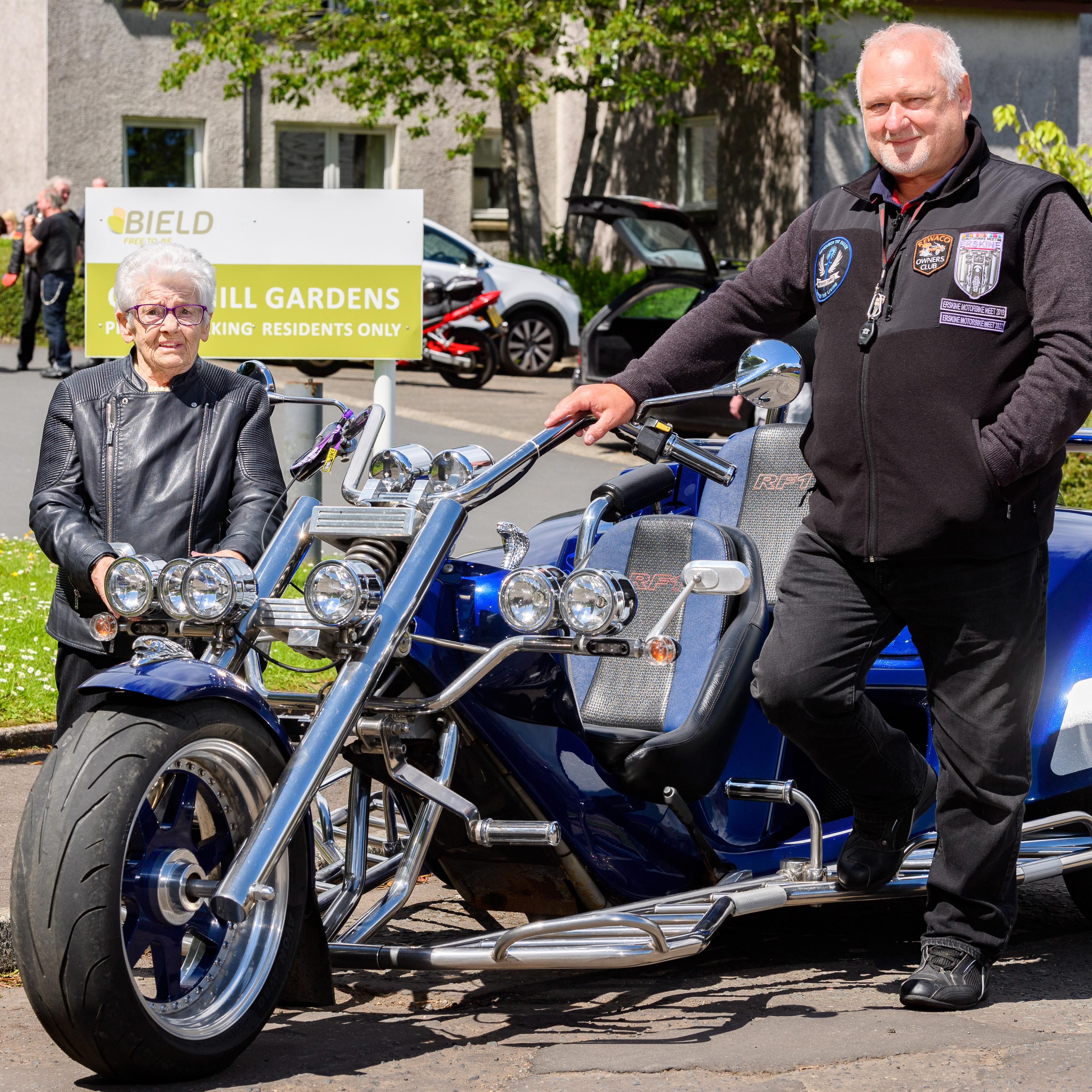 Margaret Sneddon standing next to motorbike